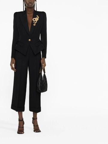 Single-breasted black tailored blazer with gold snake