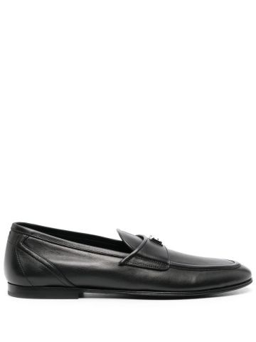 Black loafers with logo plaque