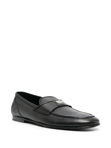 Black loafers with logo plaque