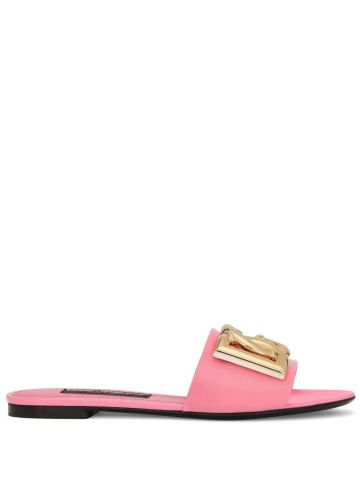 Pink slides sandals with gold logo plaque