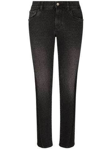 Black skinny jeans with logo plaque on the back