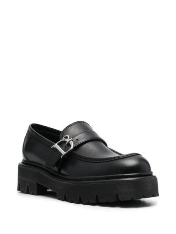 Black loafers with monogram logo