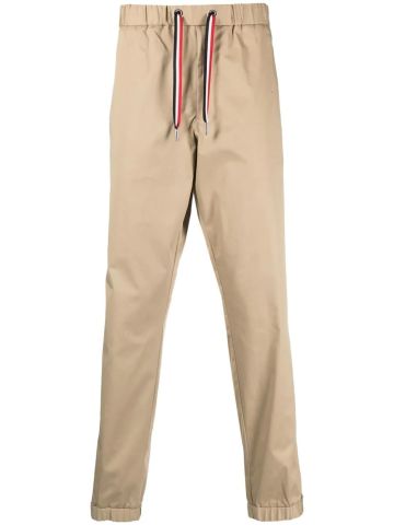 Pantaloni chino beige con coulisse logata