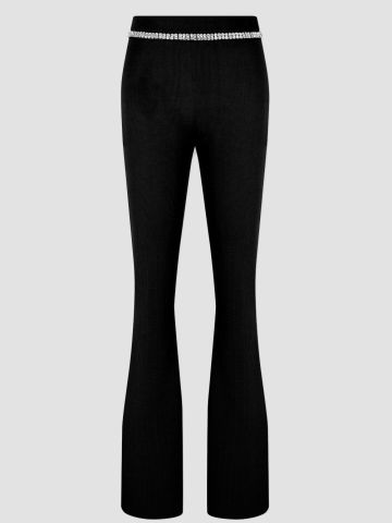 Black ribbed pants with jewel detail at waistband