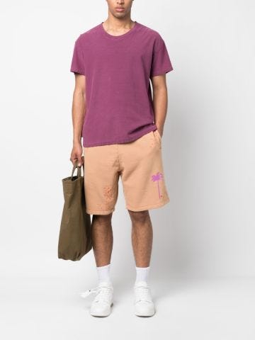Salmon pink shorts with patent leather effect