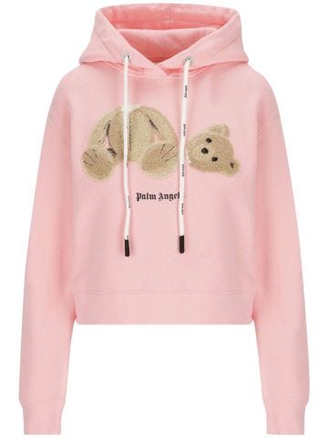 Pink hooded sweatshirt with teddy bear logo