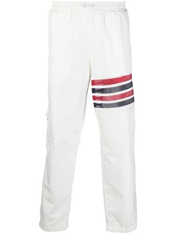 White sport pants with stripes