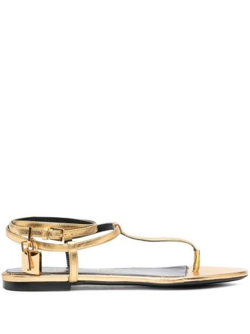Low gold thong sandals with padlock