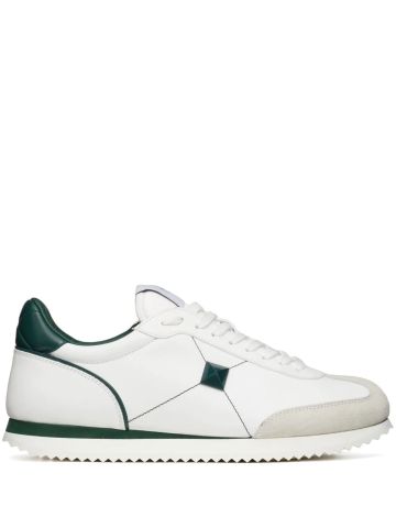 White leather sneakers with green details
