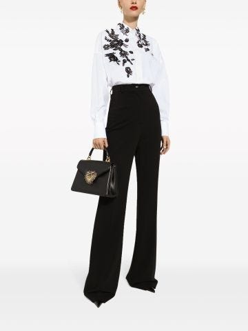 High-waisted pressed-crease flared trousers