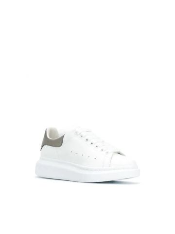 White oversized sneakers with contrasting metallic detailing