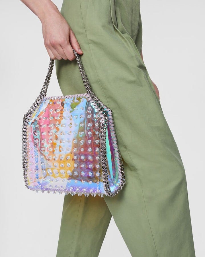 IRIDESCENT BAG: @stellamccartney's iconic Falabella bag updates its look this season with a holographic effect and studs for a super cool effect.
Available on genteroma.com and in store at Via del Babuino, 77.

#GenteRoma #StellaMcCartney #SS22